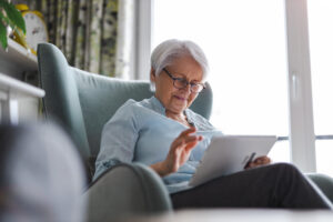 Active adult looking at her tablet doing surgeon research
